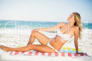 Happy woman relaxing at the beach