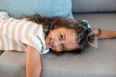 Portrait of a girl lying on sofa