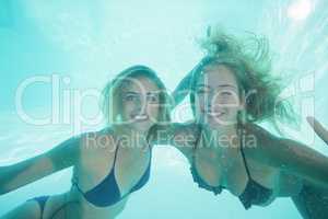 Beautiful young women underwater