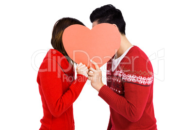 Young couple holding heart