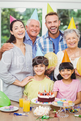 Portrait of smiling multi generation family during birthday part
