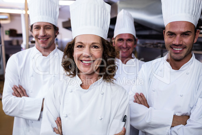 Group of happy chefs smiling at the camera