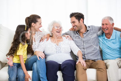 Smiling family with grandparents discussing