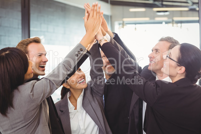 Businesspeople hands stacked over each other