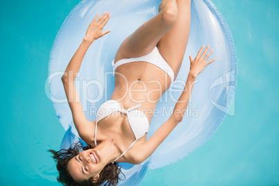 Beautiful woman relaxing on inflatable ring
