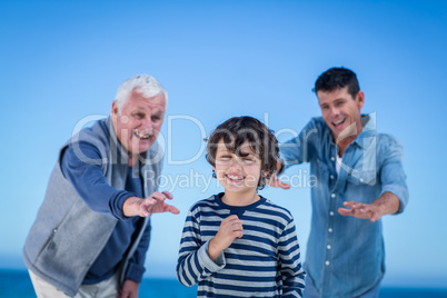 Male family members playing at the beach