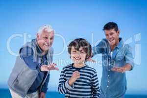 Male family members playing at the beach