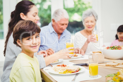 Portrait of smiling boy with family