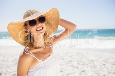 Portrait of blonde woman with straw hat