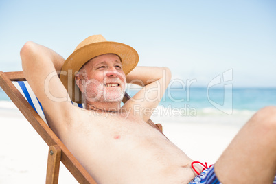 Senior man lying in a sunchair