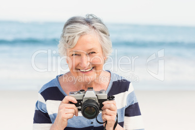 Senior woman taking picture