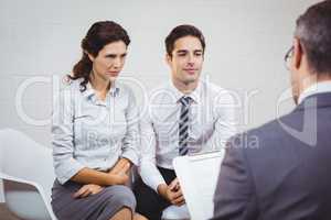 Clients interacting with businessman