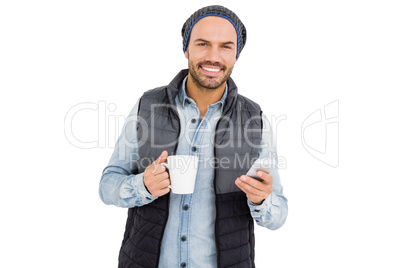 Man using mobile his phone while drinking coffee