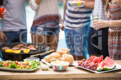 Table laid with food for outdoors barbecue party