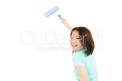 Woman painting with a sponge roller
