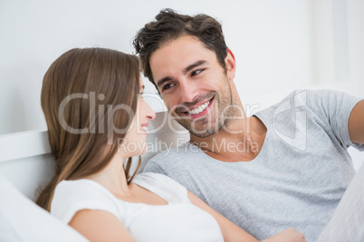 Romantic couple resting on bed