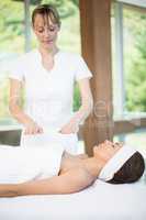 Female masseur massaging young womanMasseur massaging woman