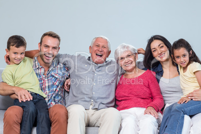 Family sitting on sofa