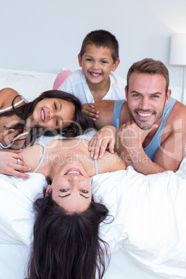 Happy family in their bedroom