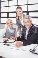 Business people with client in meeting room