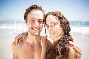 Portrait of young couple together on the beach