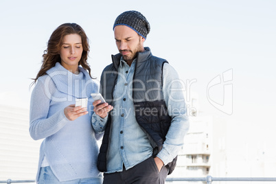 Young couple using mobile phone