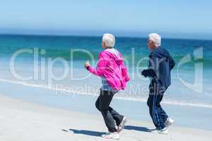 Cute mature couple running together