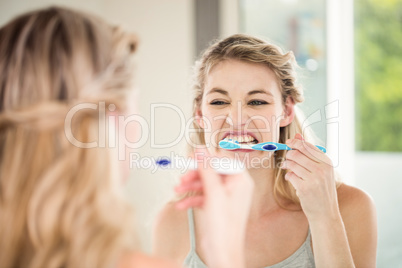 Woman brushing teeth