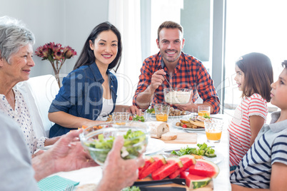 Happy family having breakfast