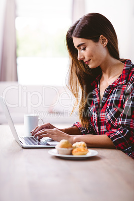 Woman typing on laptop