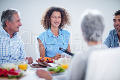 Happy family having breakfast together