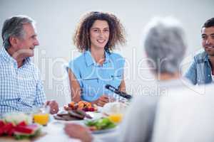 Happy family having breakfast together