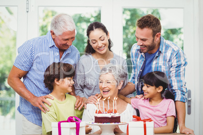 Smiling family with grandparents during birthday party