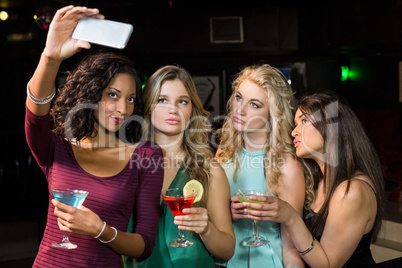 Happy friends taking a selfie