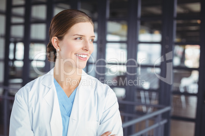 Smiling female doctor looking away