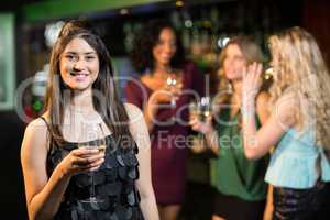 Happy friends having a drink