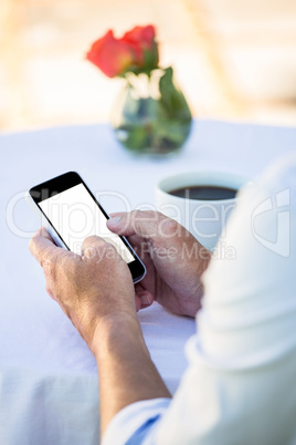 Close up of masculine hands using smartphone