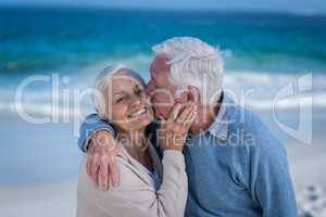 Senior couple embracing and kissing