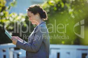 Pretty businesswoman using tablet