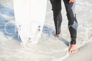 Surfers feet on the beach