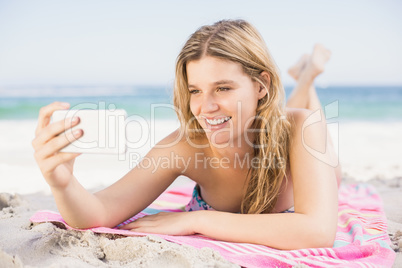 Young woman taking a selfie on mobile phone