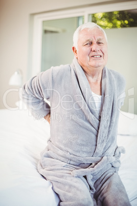 Portrait of man grimacing from back pain