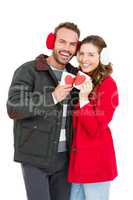 Happy young couple holding coffee mug