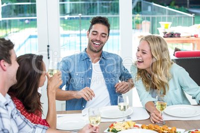 Smiling young friends discussing