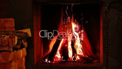 Fire in the Fireplace and Basket of Firewood. Real Audio