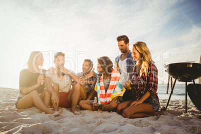 Happy friends having fun near barbecue