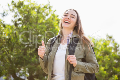 Smiling woman with backpack