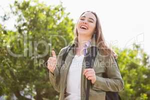 Smiling woman with backpack