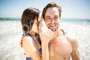 Young couple embracing on the beach