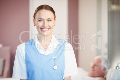 Portrait of happy beautiful nurse at home